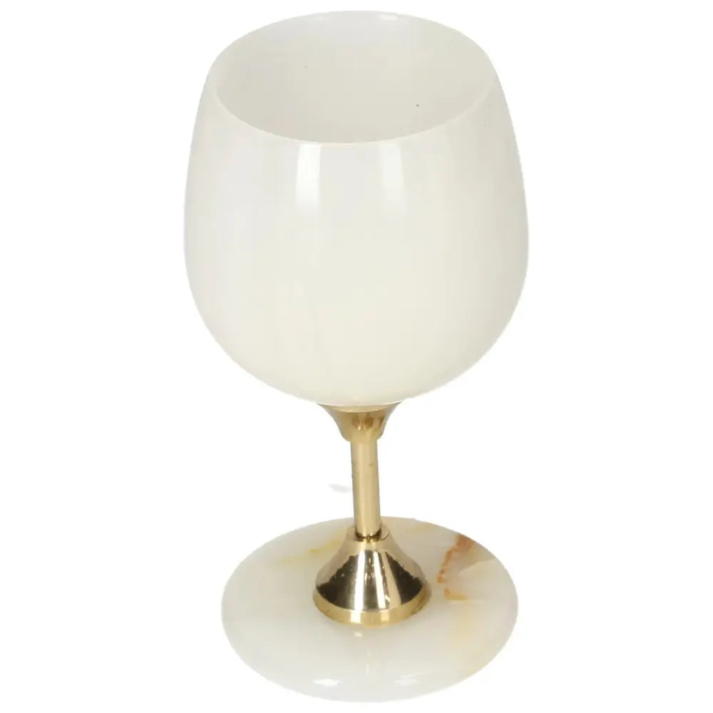 Luxurious onyx wine glass with gold stem, showcasing unique off-white coloration and elegant craftsmanship for stylish drinking experiences.