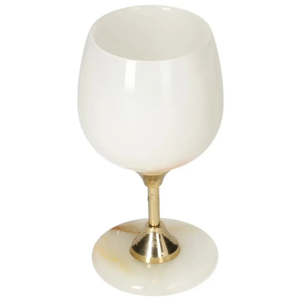 Elegant off-white onyx wine glass with golden stem, showcasing unique veining and polished finish for sophisticated drinking experiences.