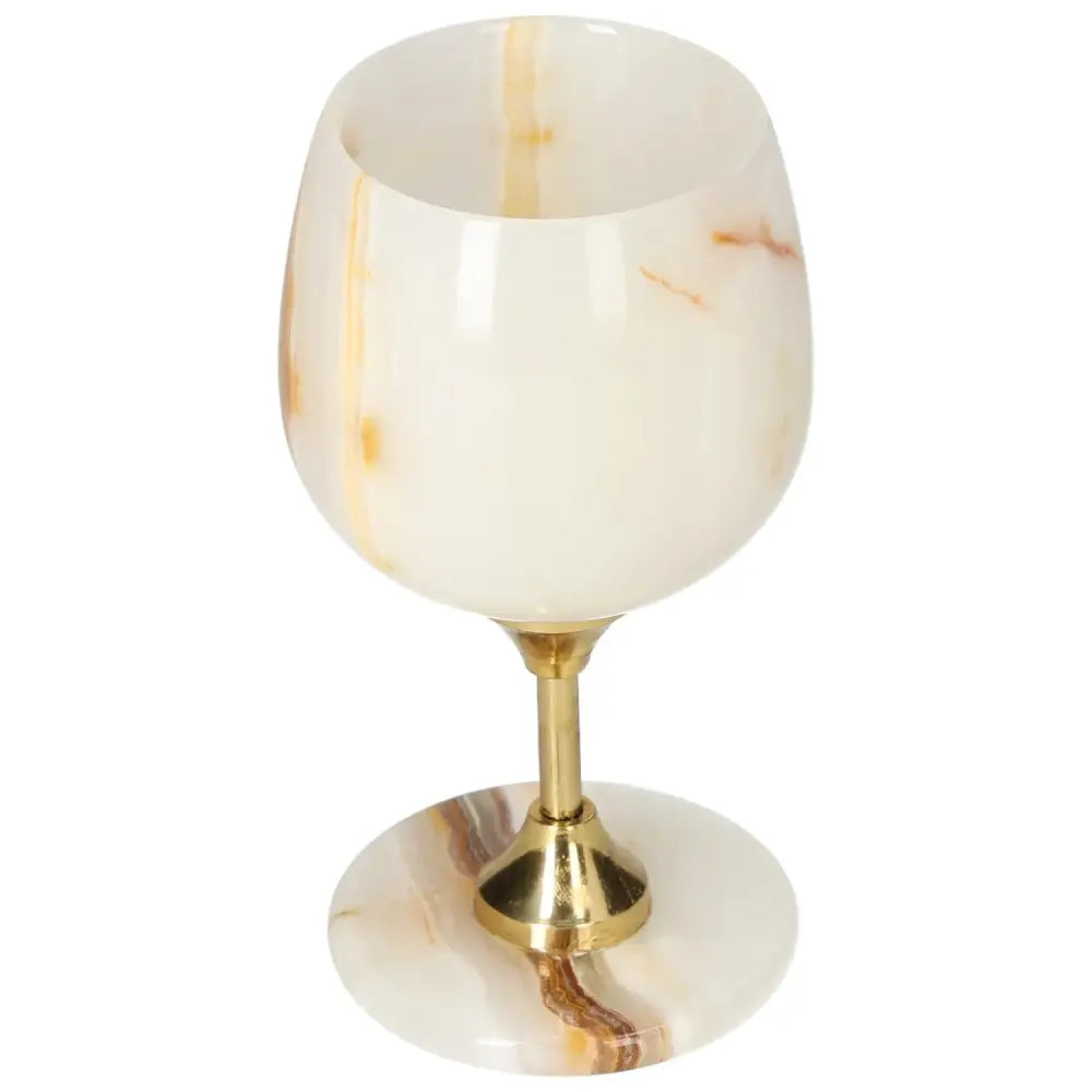 Elegant onyx wine glass with gold stem and unique veining, showcasing natural beauty and sophistication for fine dining experiences.