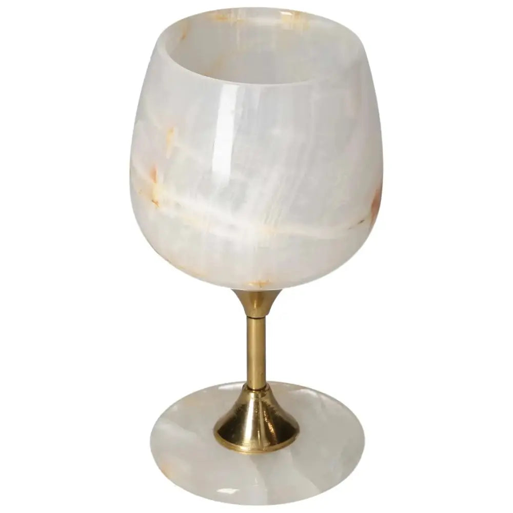 Exquisite off-white onyx wine glass with unique veining and polished surface on a gold stem, perfect for elegant occasions.