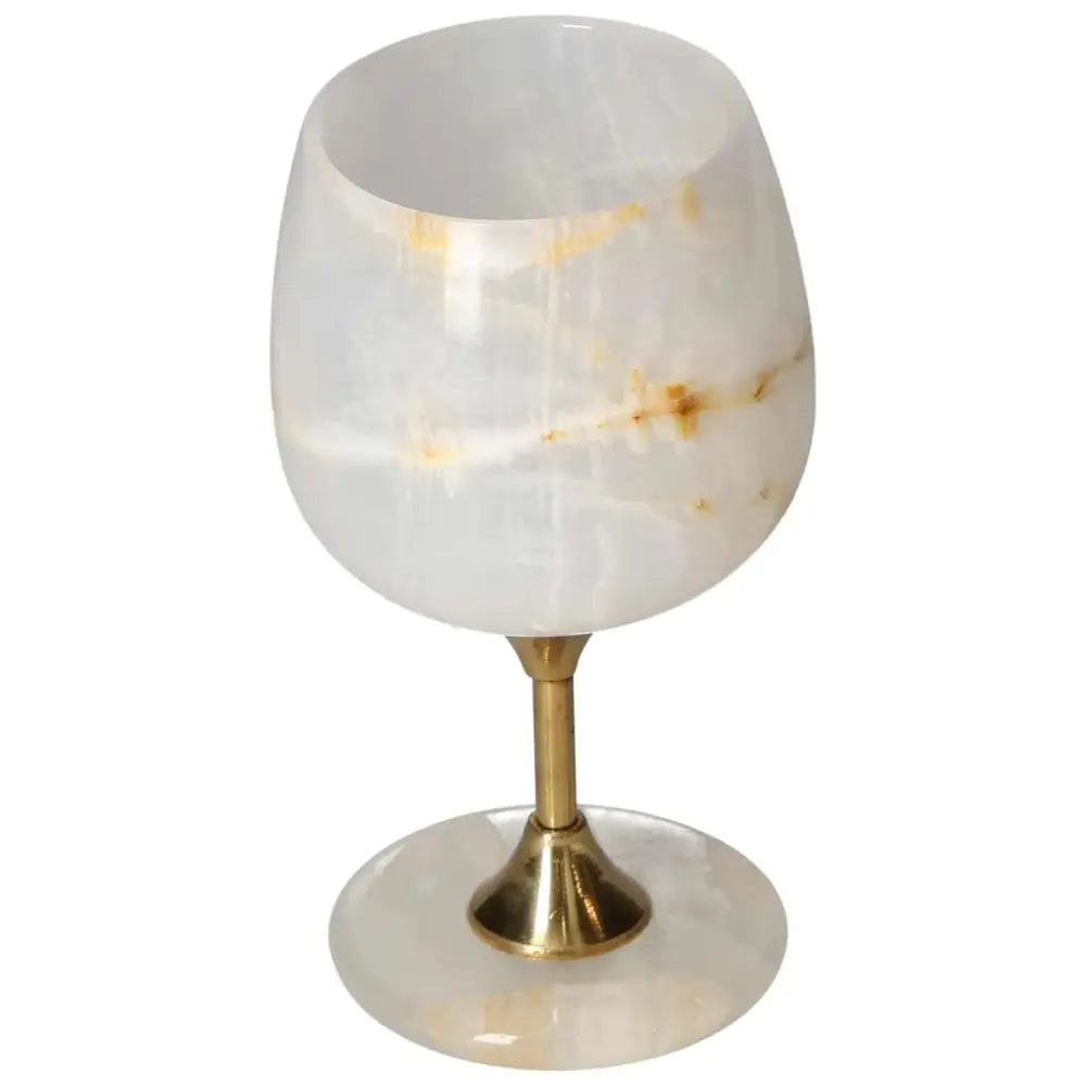 Elegant off-white onyx wine glass with unique veining and gold stem, perfect for sophisticated gatherings and fine dining experiences.