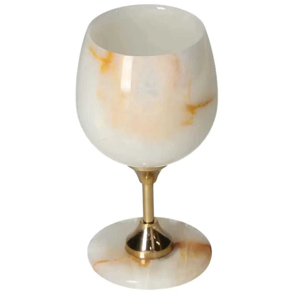 Elegant off-white onyx wine glass with gold stem, showcasing unique veining and polished finish, ideal for sophisticated gatherings.