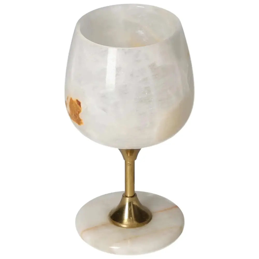 Premium off-white onyx wine glass with unique veining and a polished finish, featuring an elegant gold-toned stem, on white surface.