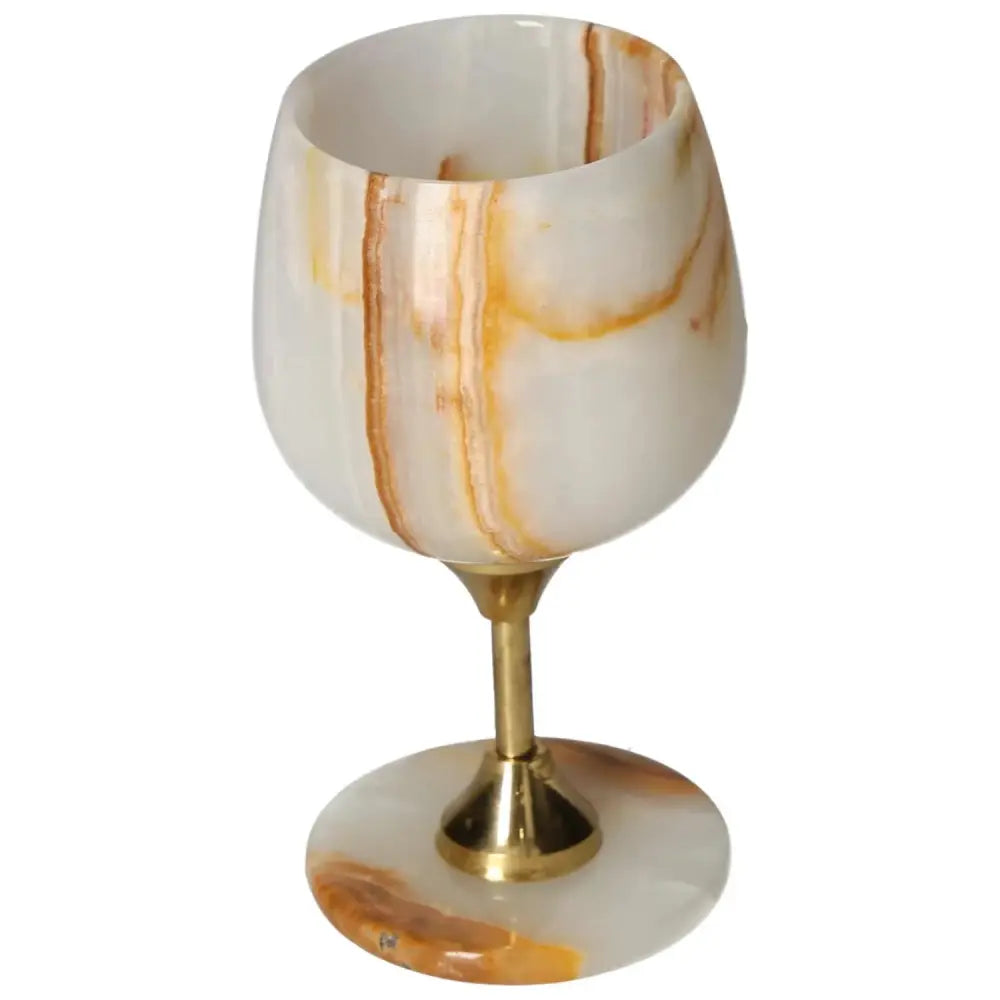Exquisite off-white onyx wine glass with gold stem, showcasing elegant veining patterns, perfect for sophisticated dining experiences.