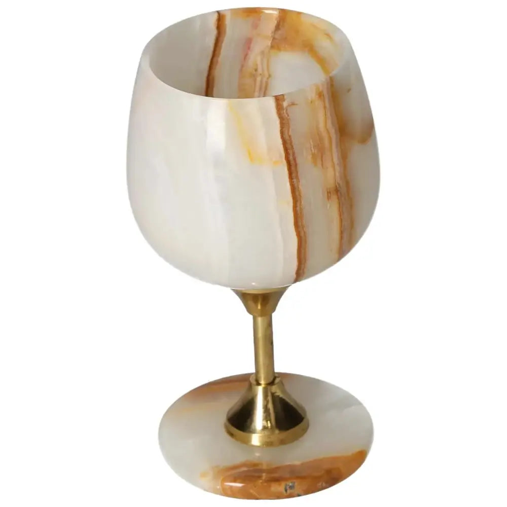 Elegant onyx wine glass with unique veining and polished off-white surface, perfect for adding sophistication to special occasions.