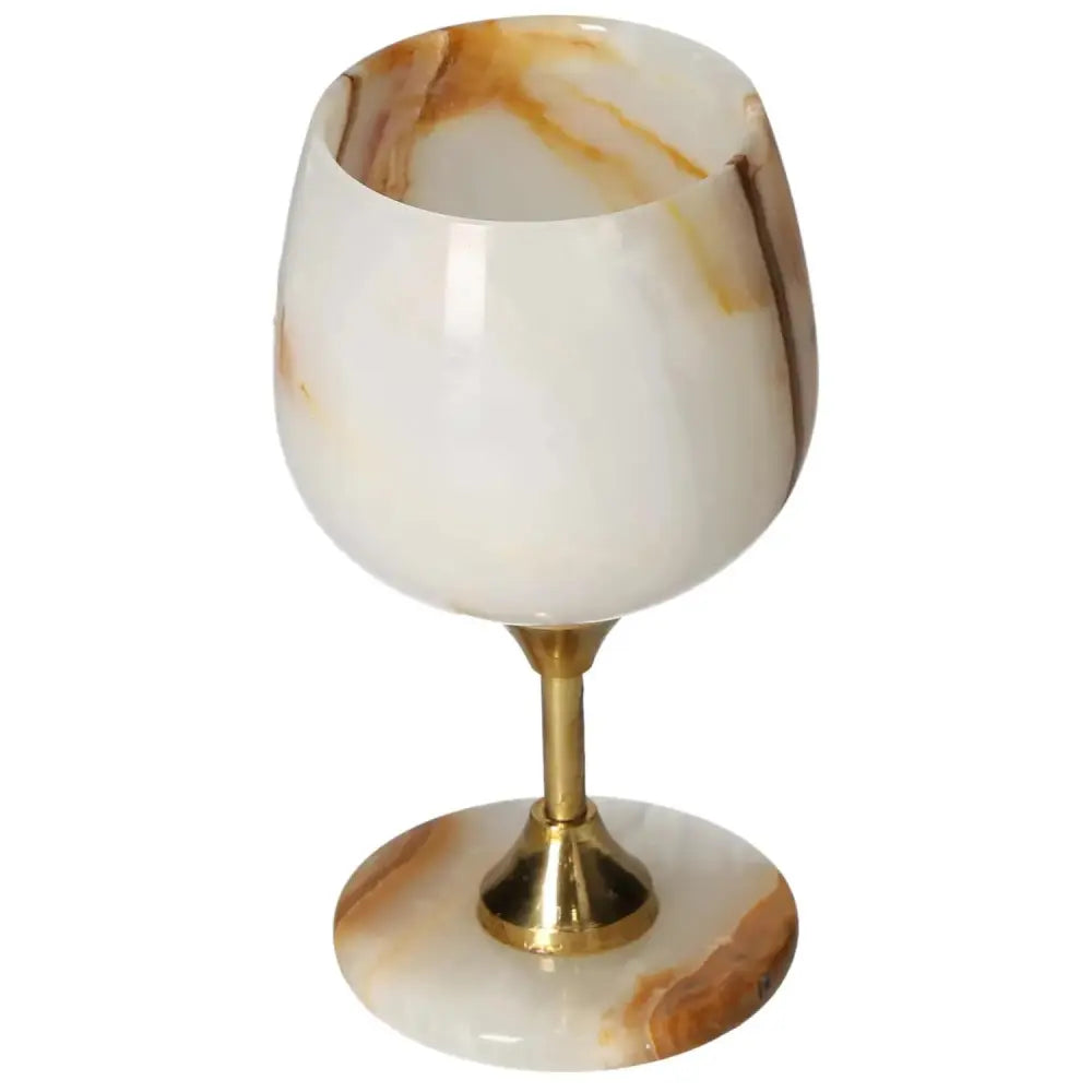 Exquisite off-white onyx wine glass with unique veining and gold stem, perfect for elegant dining and sophisticated occasions.