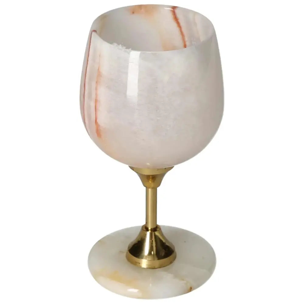 Exquisite onyx wine glass with golden stem, showcasing natural veining and polished surface for elegant fine drinking experiences.