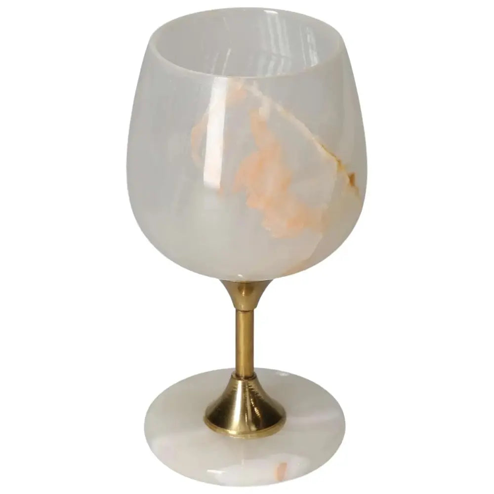 Elegant off-white onyx wine glass with unique veining and polished surface, featuring a gold-toned stem for a touch of sophistication.