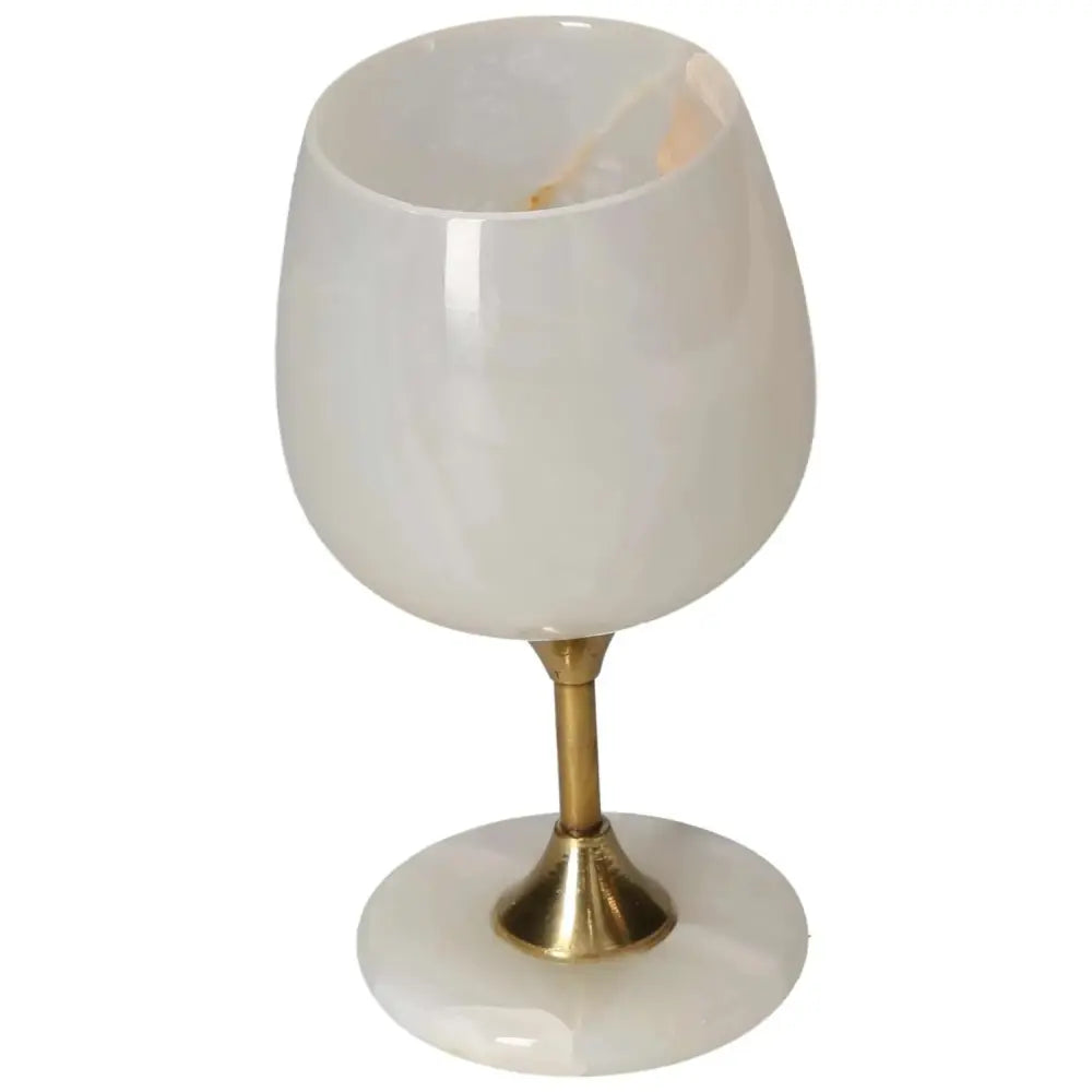 Elegant onyx wine glass with golden stem, showcasing natural off-white hues and unique veining for a sophisticated drinking experience.