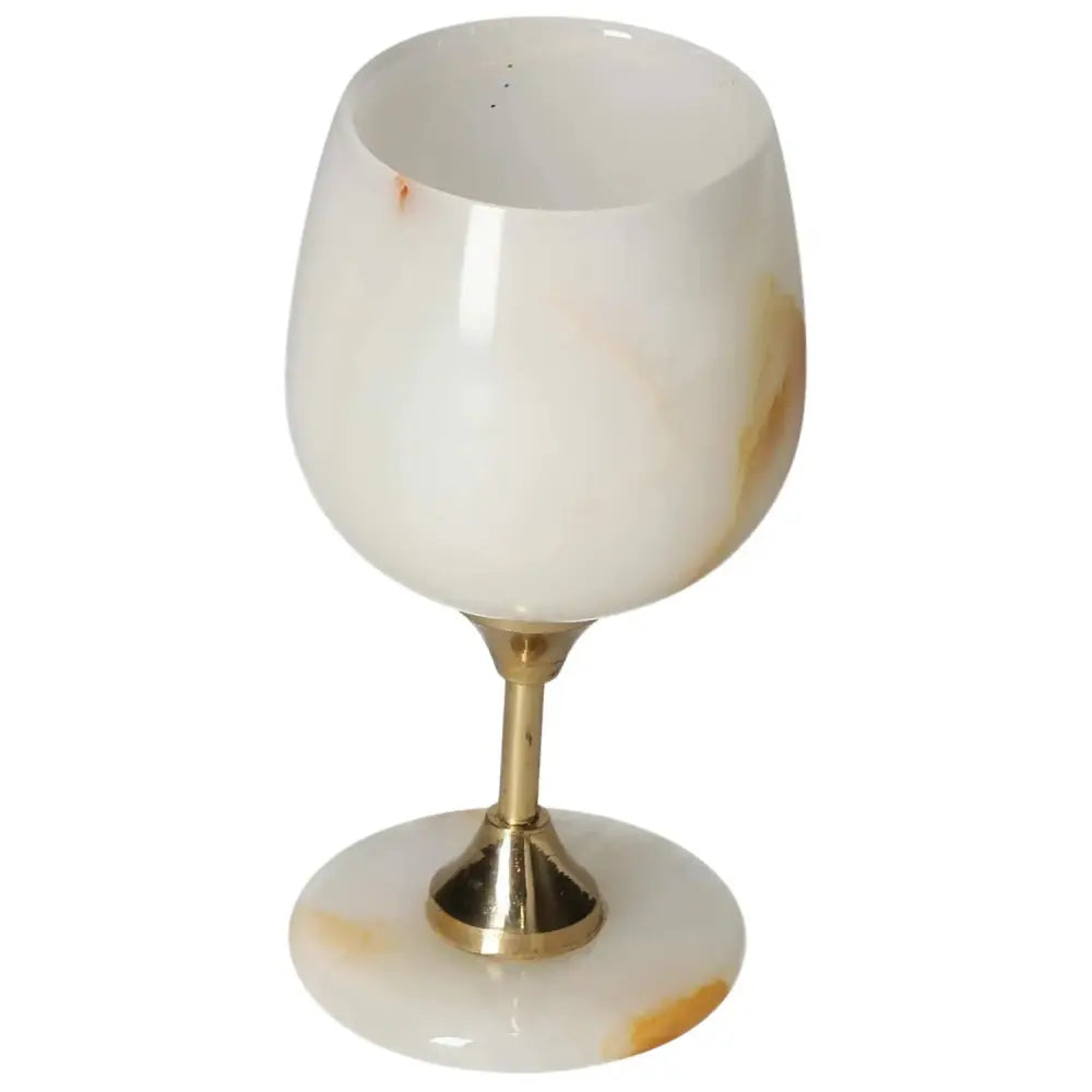 Luxurious off-white onyx wine glass with unique veining and polished finish, perfect for elegant fine drinking occasions.