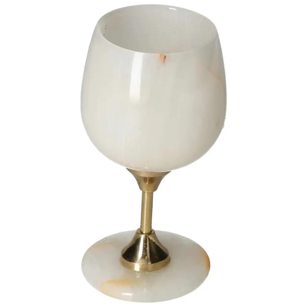 Luxurious onyx wine glass with unique veining and polished finish, perfect for elegant dining experiences.