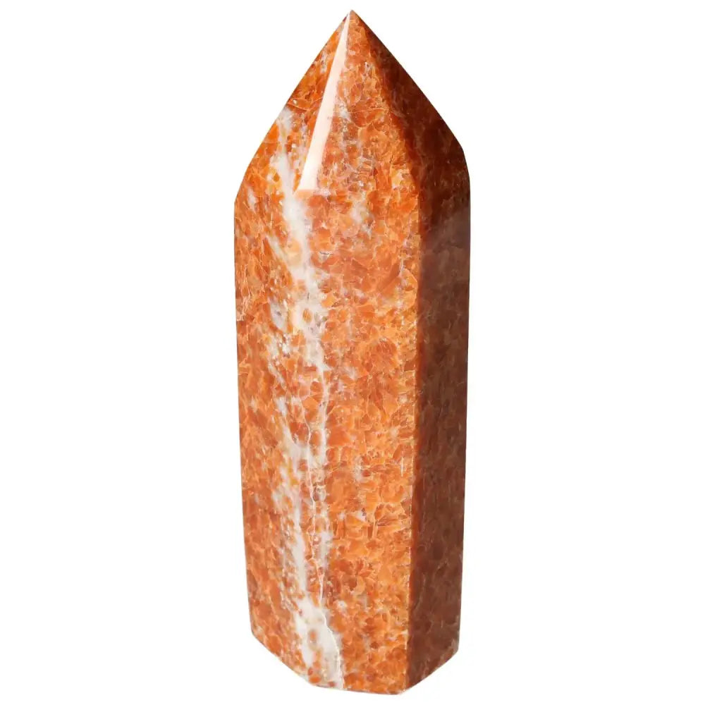 Orchid Calcite Obelisk from Sylvia Crystals, showcasing vibrant orange and creamy hues, symbolizing grounding energy and clarity.