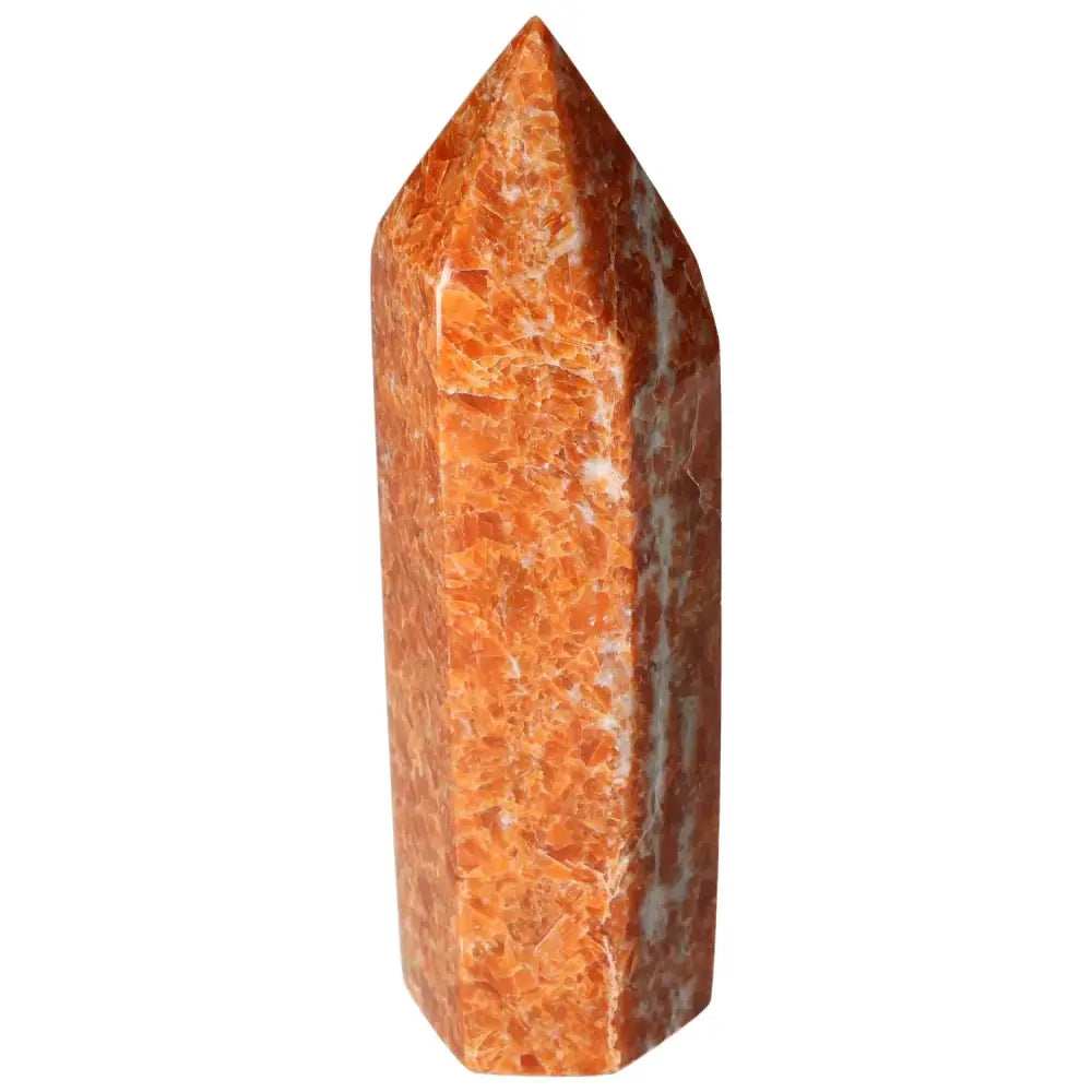 Orchid Calcite Obelisk with vibrant orange and white hues from Sylvia Crystals, symbolizing grounding energy and spiritual growth.