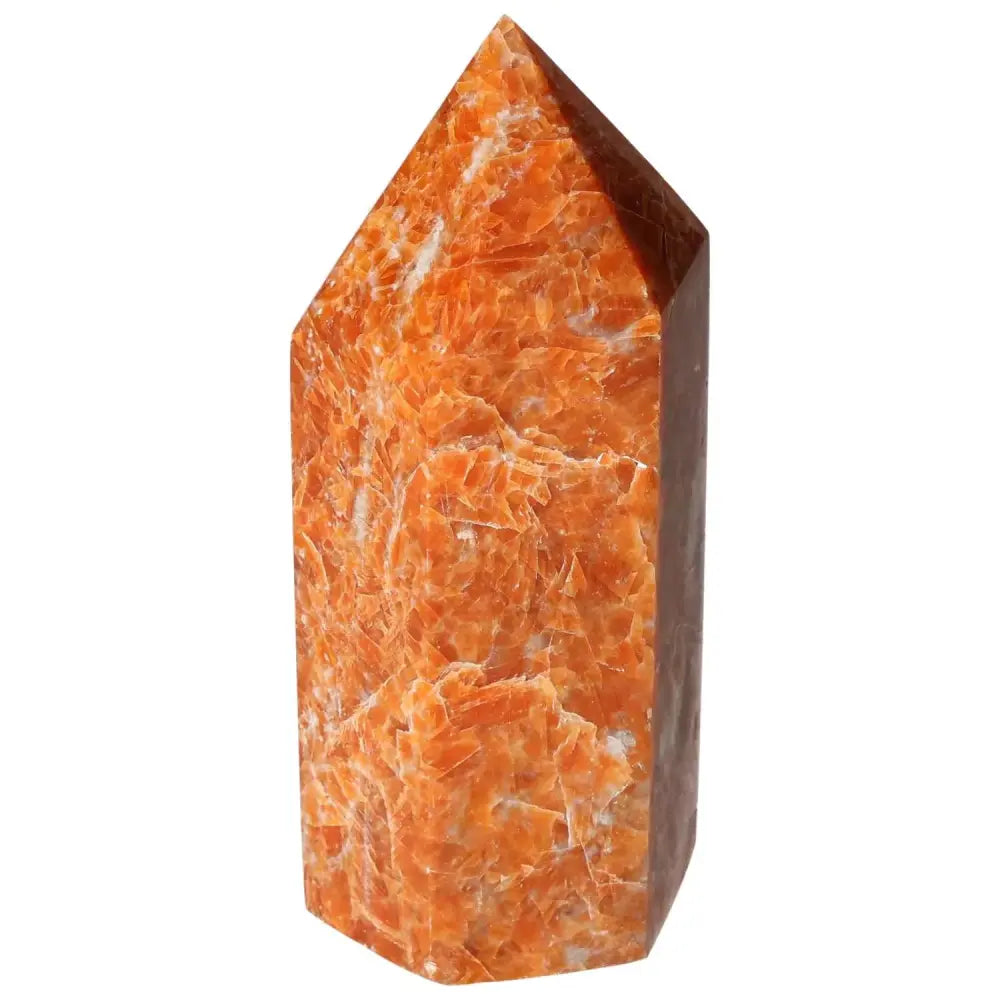 Orchid Calcite Obelisk with orange-peach hues by Sylvia Crystals, showcasing quality craftsmanship and aesthetic allure.