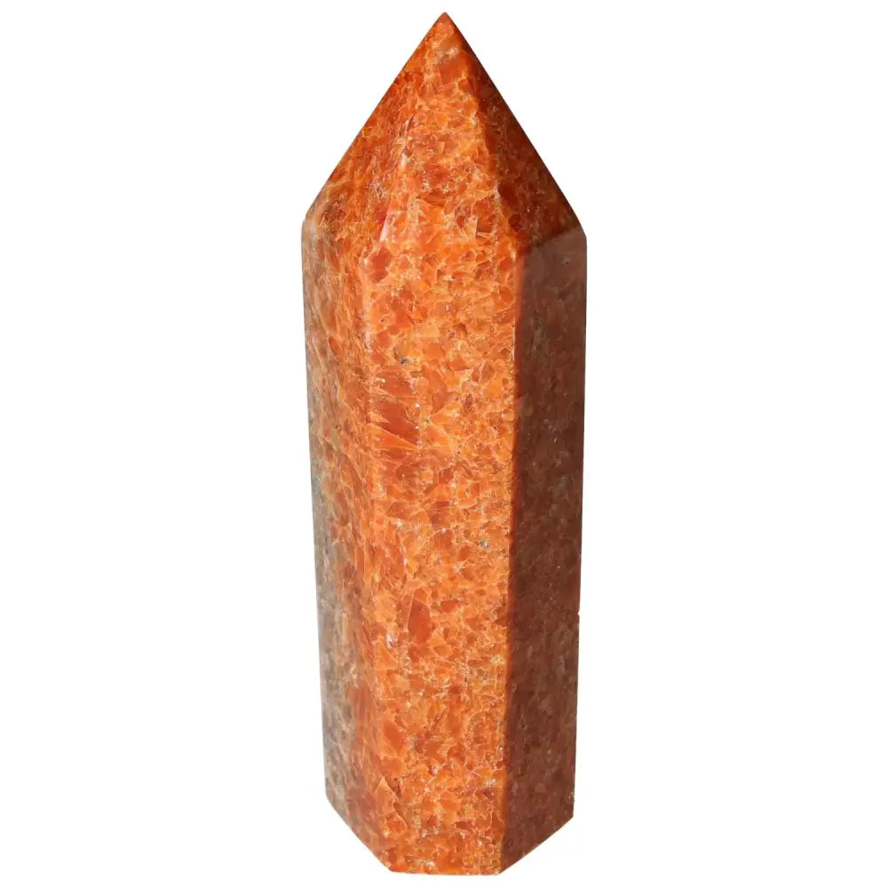 Orchid Calcite Obelisk with vibrant orange hues, symbolizing clarity and spiritual growth, by Sylvia Crystals.