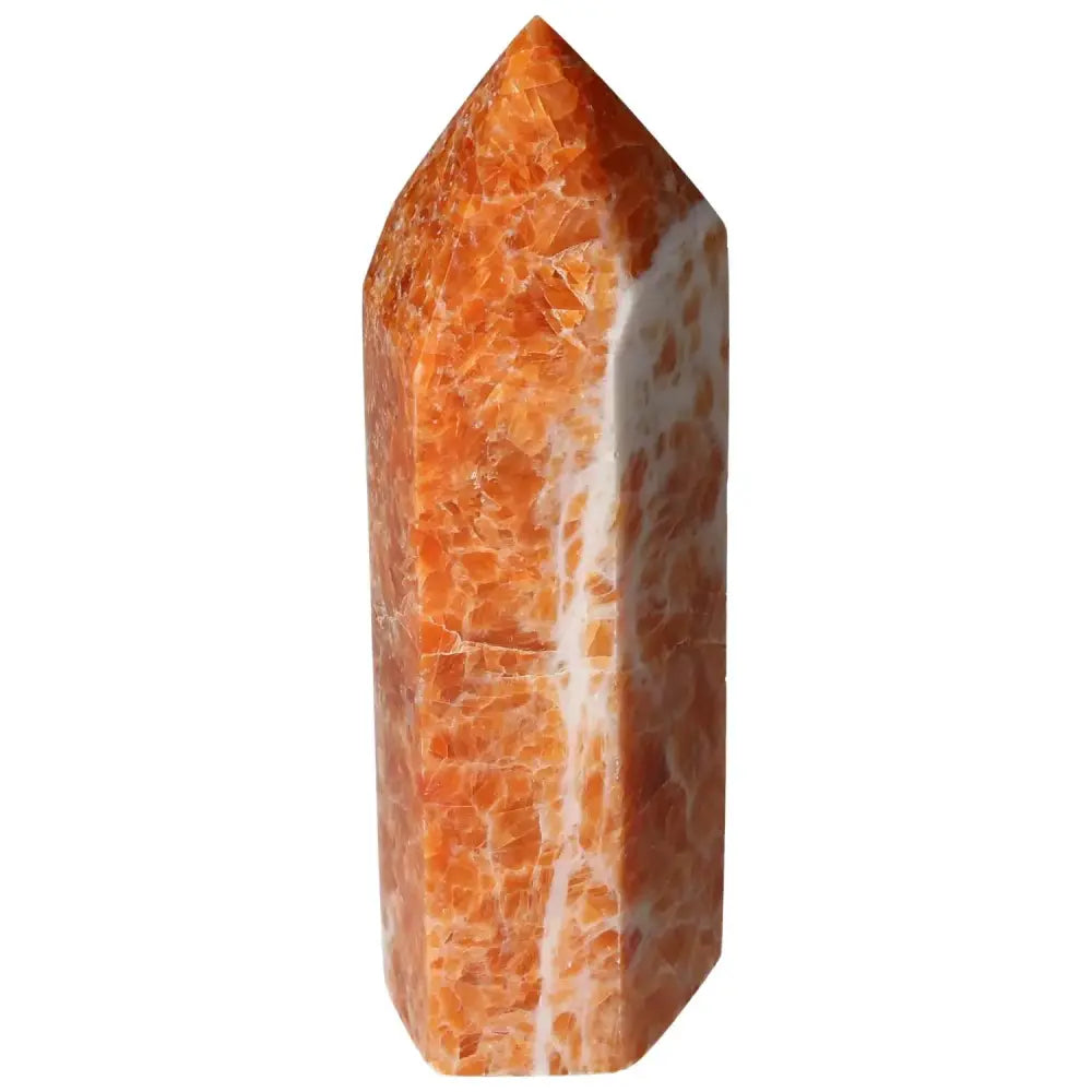 Orchid Calcite Obelisk with vibrant orange and creamy white hues, showcasing luxury and sophistication from Sylvia Crystals.