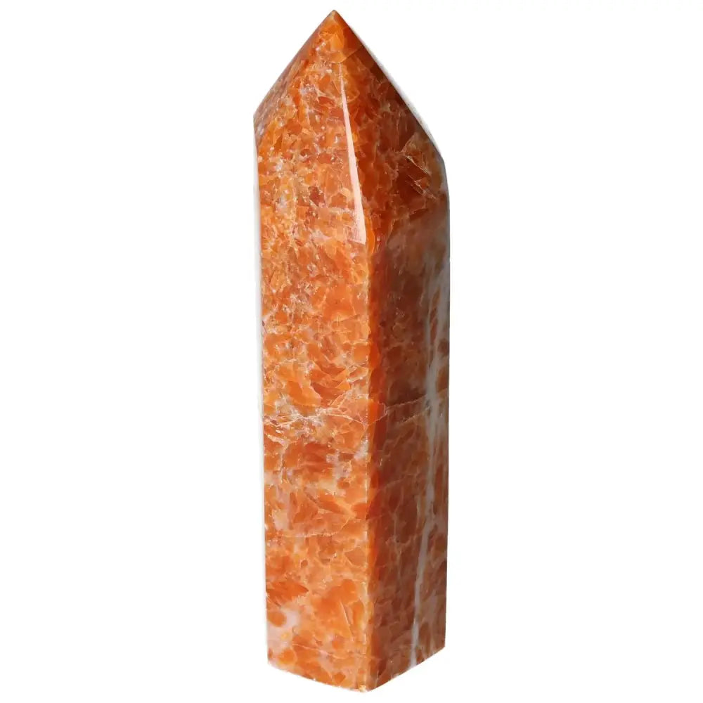 Orchid Calcite Obelisk with orange and peach hues, handpicked by Sylvia Crystals for luxury and sophistication.