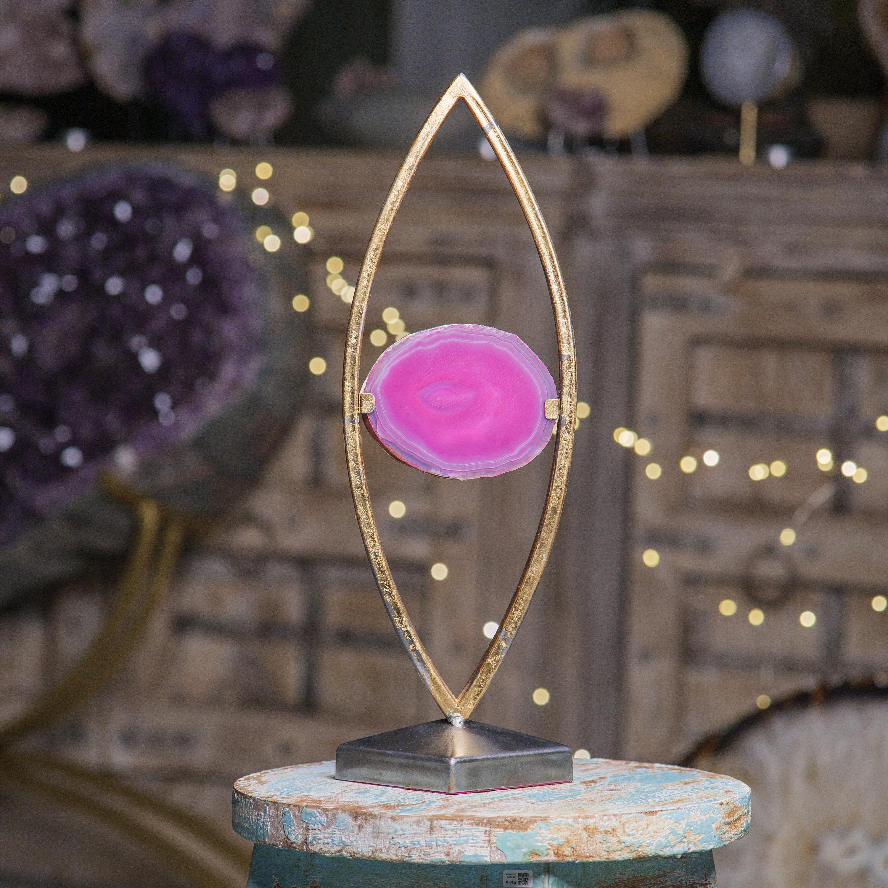 Handmade agate lamp with pink agate slice on a decorative stand, adding elegant ambiance to home décor.