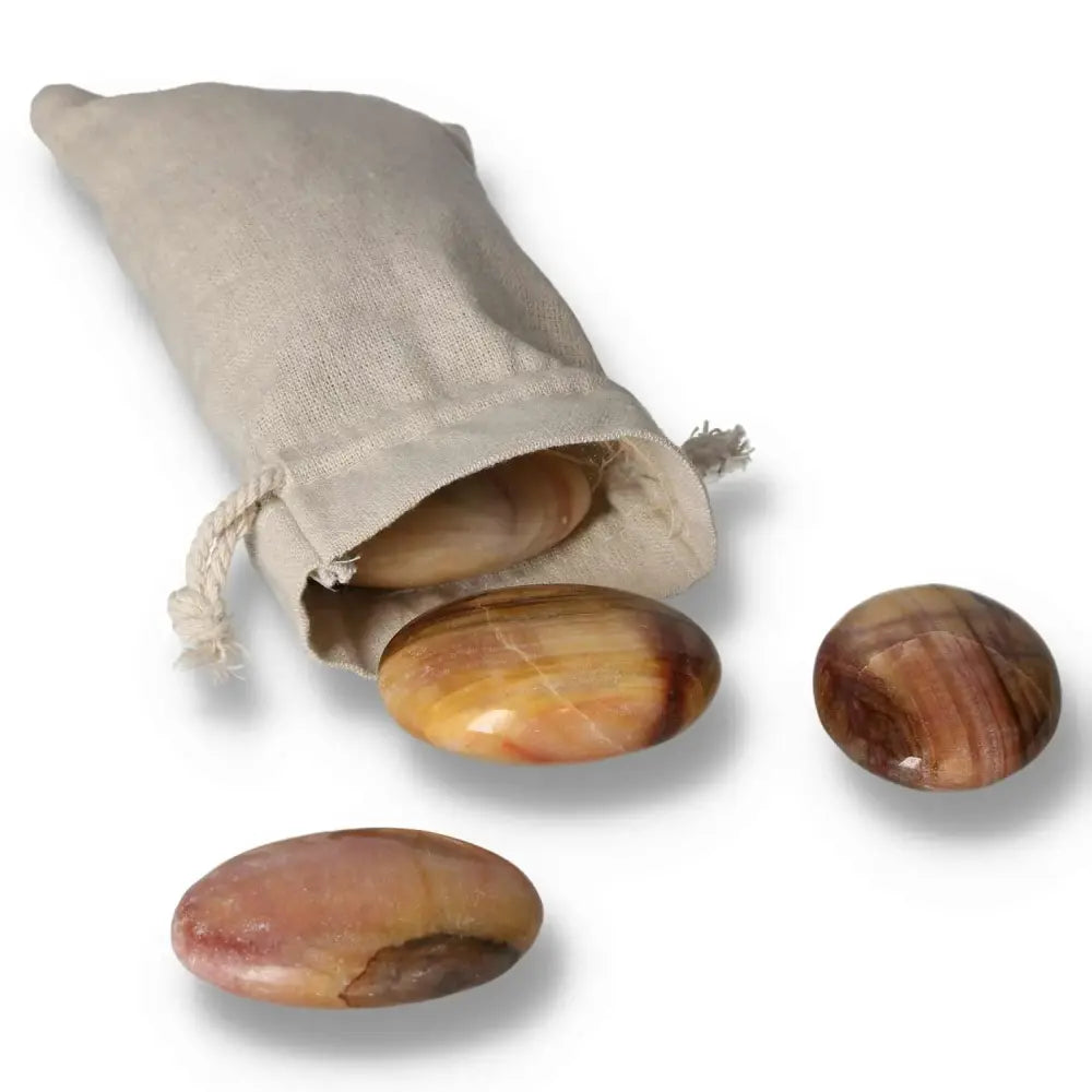 Peach Calcite Palm Stones with pouch, promoting inner peace, emotional healing, and creativity. Perfect for meditation. Soft hues.
