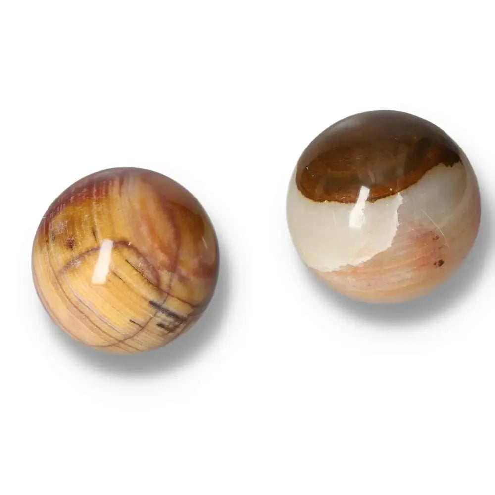 Pair of polished Peach Calcite spheres, radiating warmth and promoting harmony and emotional renewal, perfect for crystal collections.