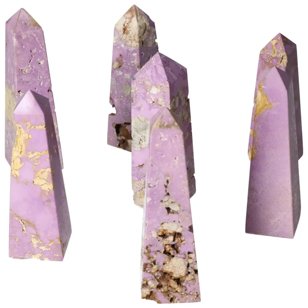 Purple Phosphosidente crystal towers with natural formations on white background, showcasing mineral textures and unique hues.