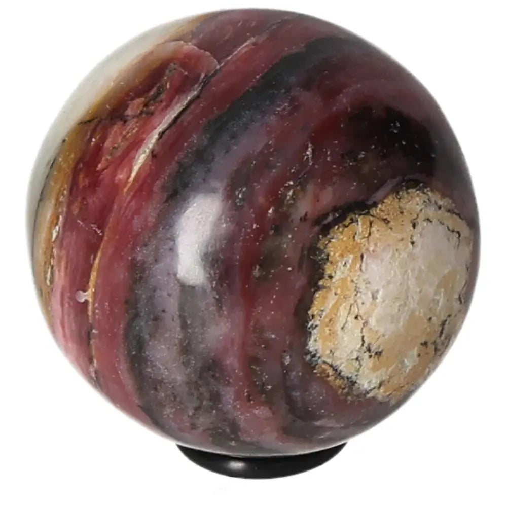 Polished pink opal sphere with natural stone texture on a display stand.