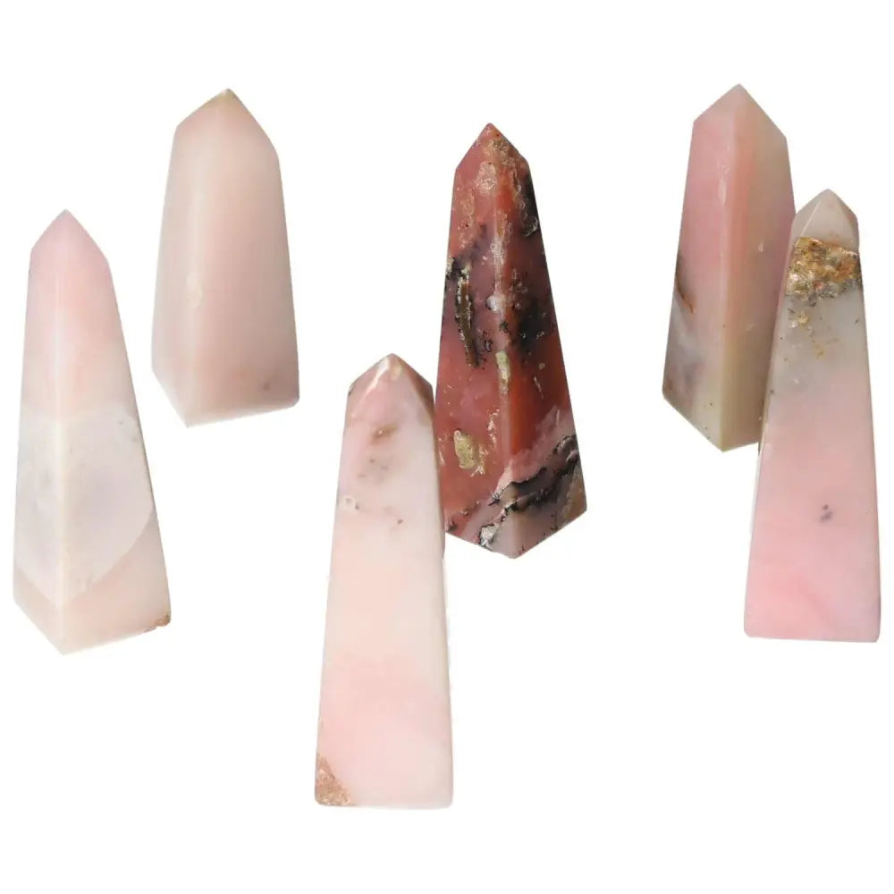 Collection of Pink Opal Towers showcasing soothing pastel hues, known for emotional healing and personal transformation.