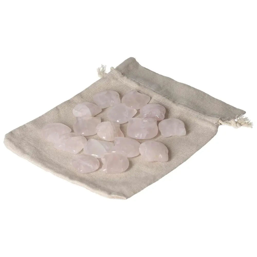Pink quartz small cat-shaped stones in a drawstring bag, perfect for collectors and crystal enthusiasts.