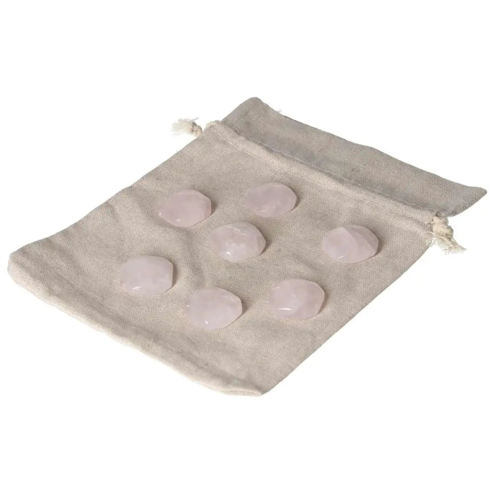 Pink Quartz small square palmstones on a beige cloth, ideal for love, emotional healing, and heart chakra support.