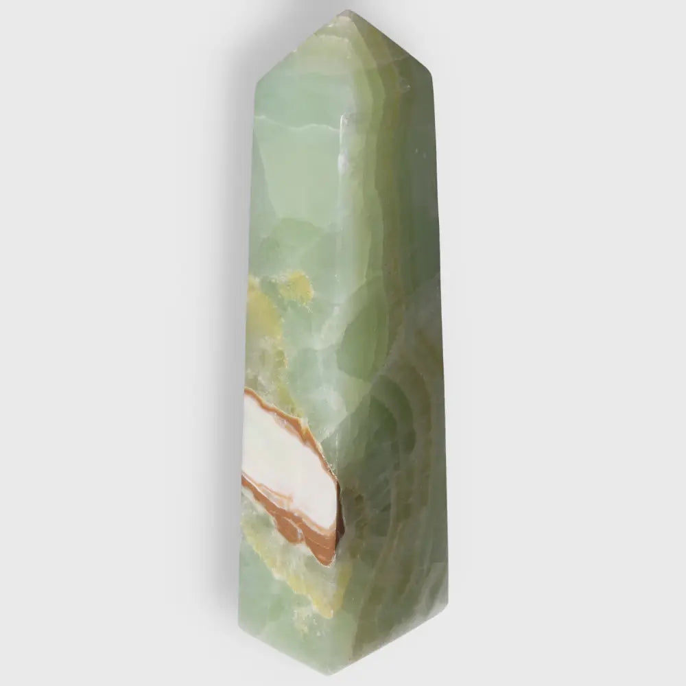 Pistachio Calcite Tower with soothing green hues, perfect for balance and harmony in your space