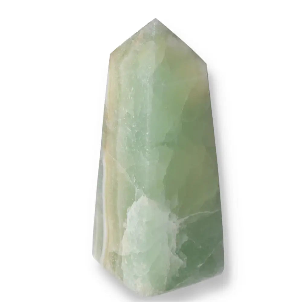 Pistachio Calcite Tower crystal with pale green hues, promoting calm and renewal, ideal for balance and harmony in any space.