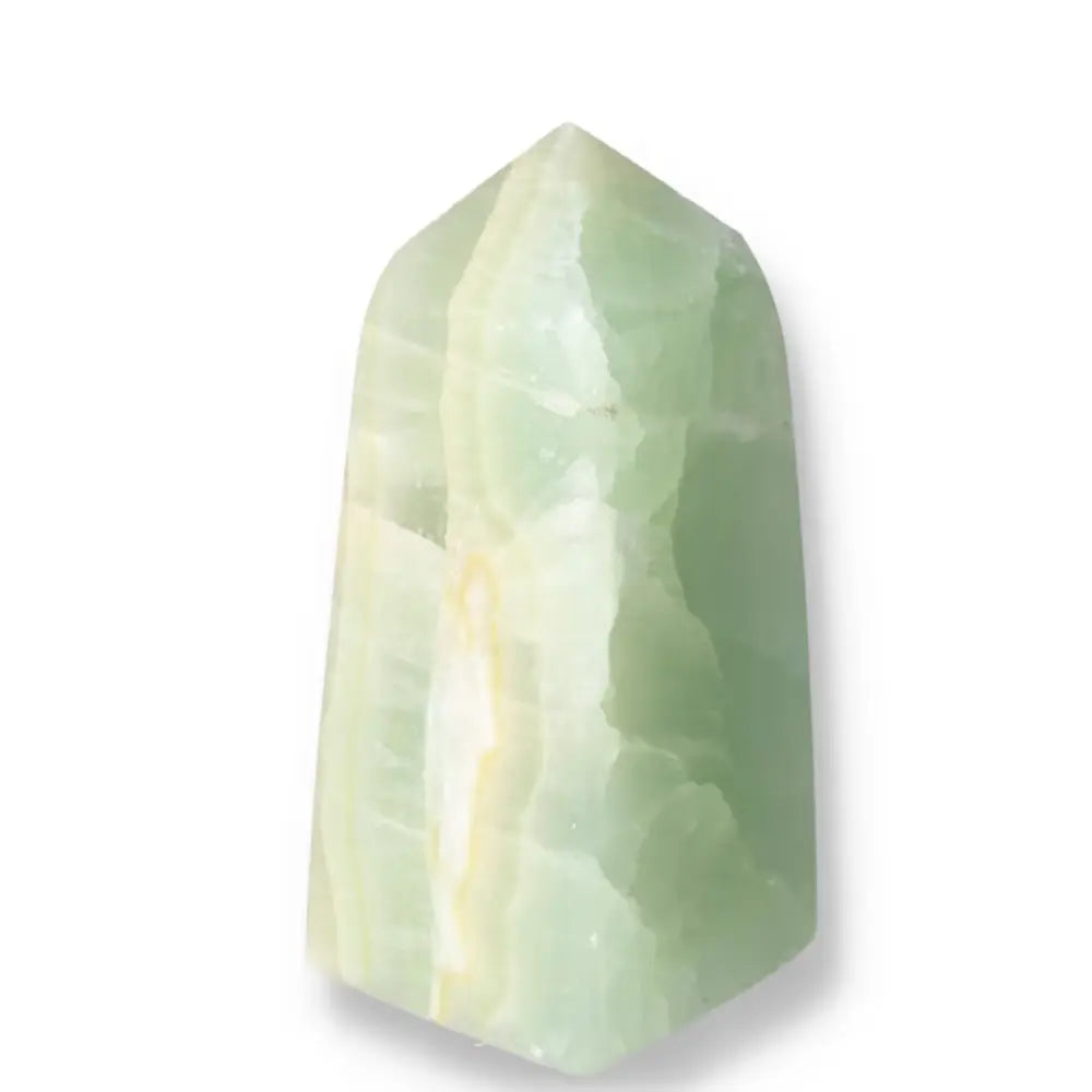 Pistachio Calcite Tower crystal displaying pale green hues with a smooth, polished surface, promoting calm and renewal.