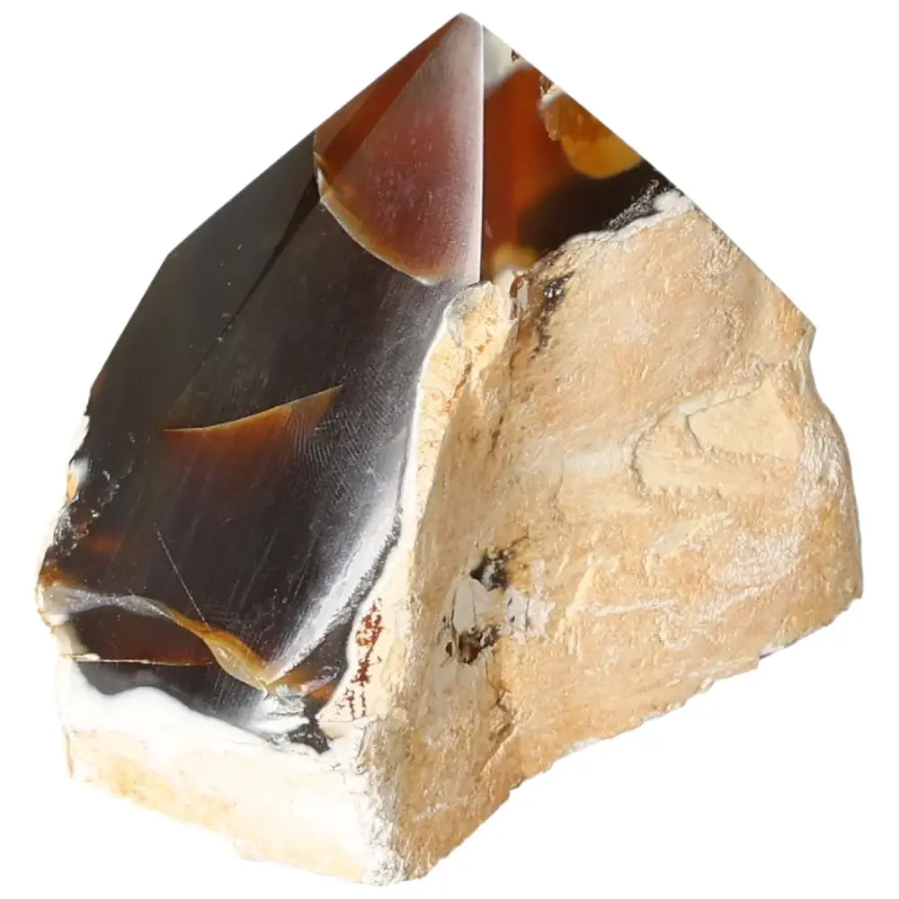 Close-up of a polished agate point crystal, offering serene energy and tranquility, exclusively from Sylvia Crystals.