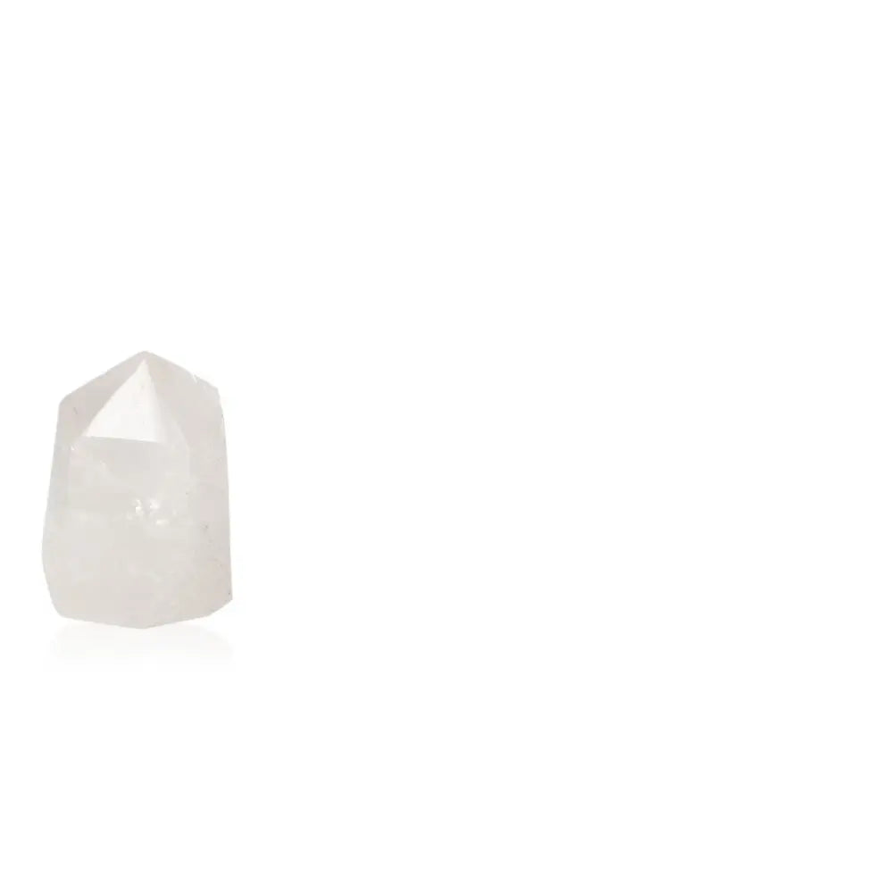 Polished crystal quartz point enhancing harmony and energy in spaces.