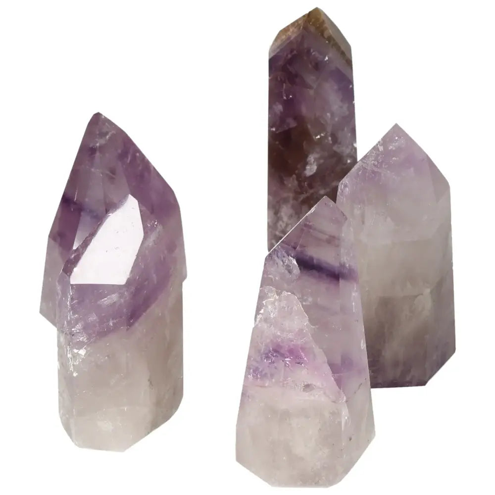 Polished Point Amethyst Crystals by Sylvia Crystals, promoting tranquility and mental clarity, showcasing elegant, handpicked gems.