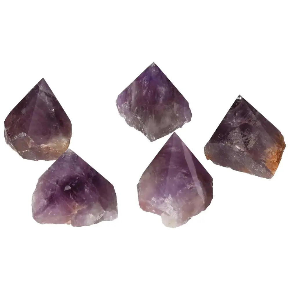 Collection of five polished point Amethyst M crystals, featuring rich purple hues, crafted by Sylvia Crystals for enhanced well-being.