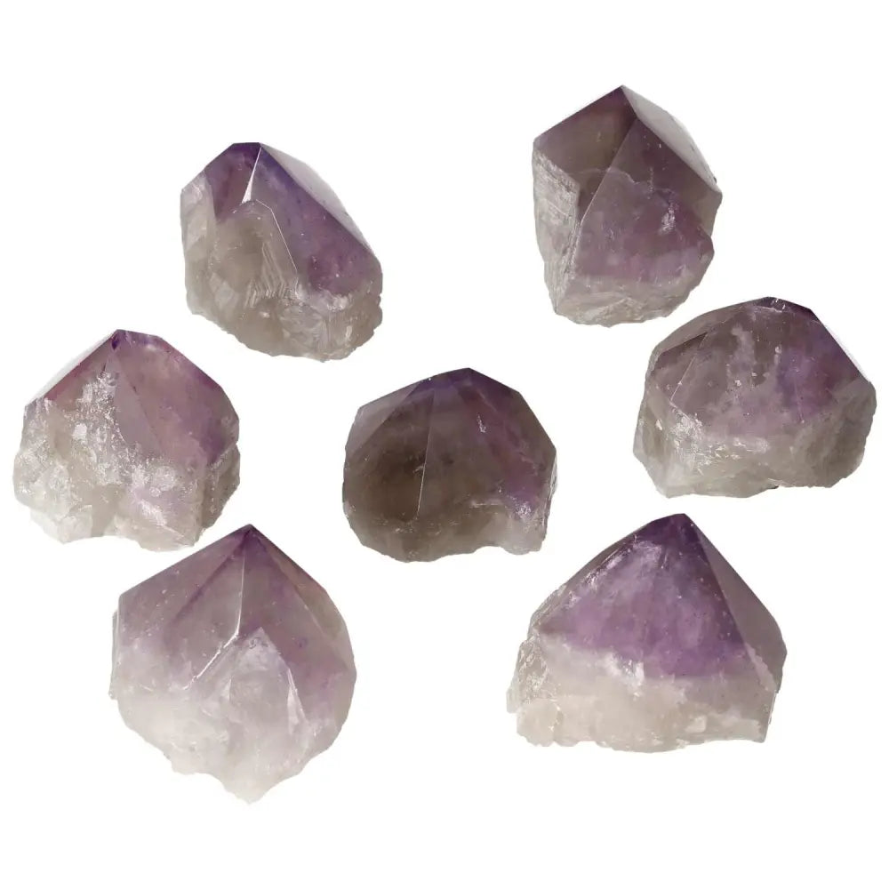 Seven polished point amethysts from Sylvia Crystals, showcasing premium quality and calming properties.