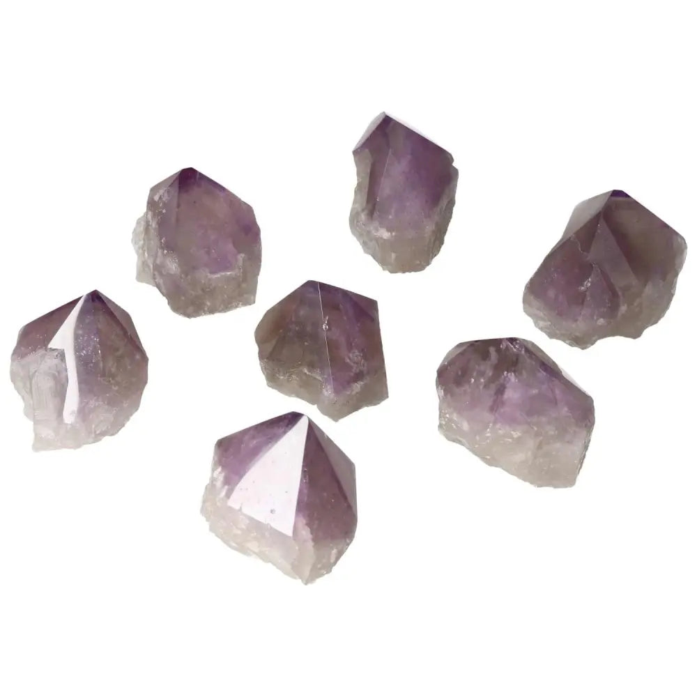 Polished Point Amethyst S crystals from Sylvia Crystals, known for calming and enhancing concentration, luxury spiritual elegance.
