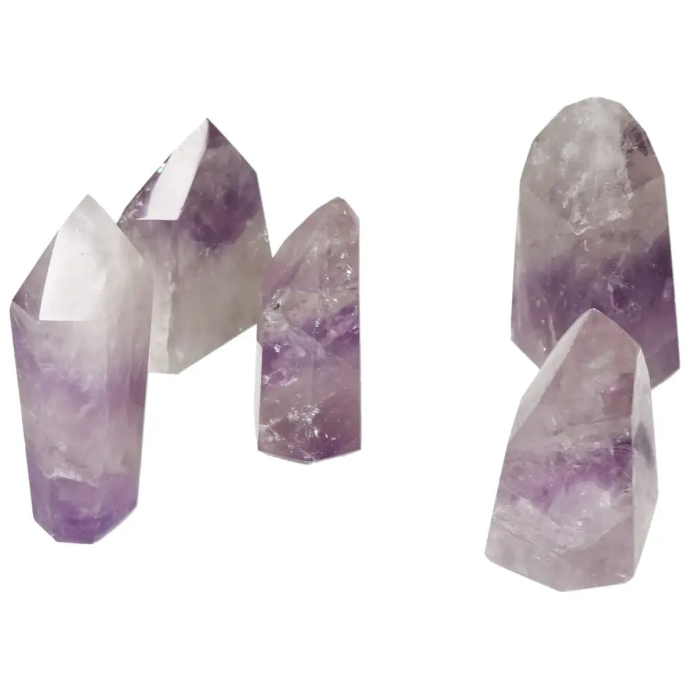 Polished Point Amethyst S gemstones by Sylvia Crystals, ideal for stress relief and energy boost, with elegant, handpicked designs.