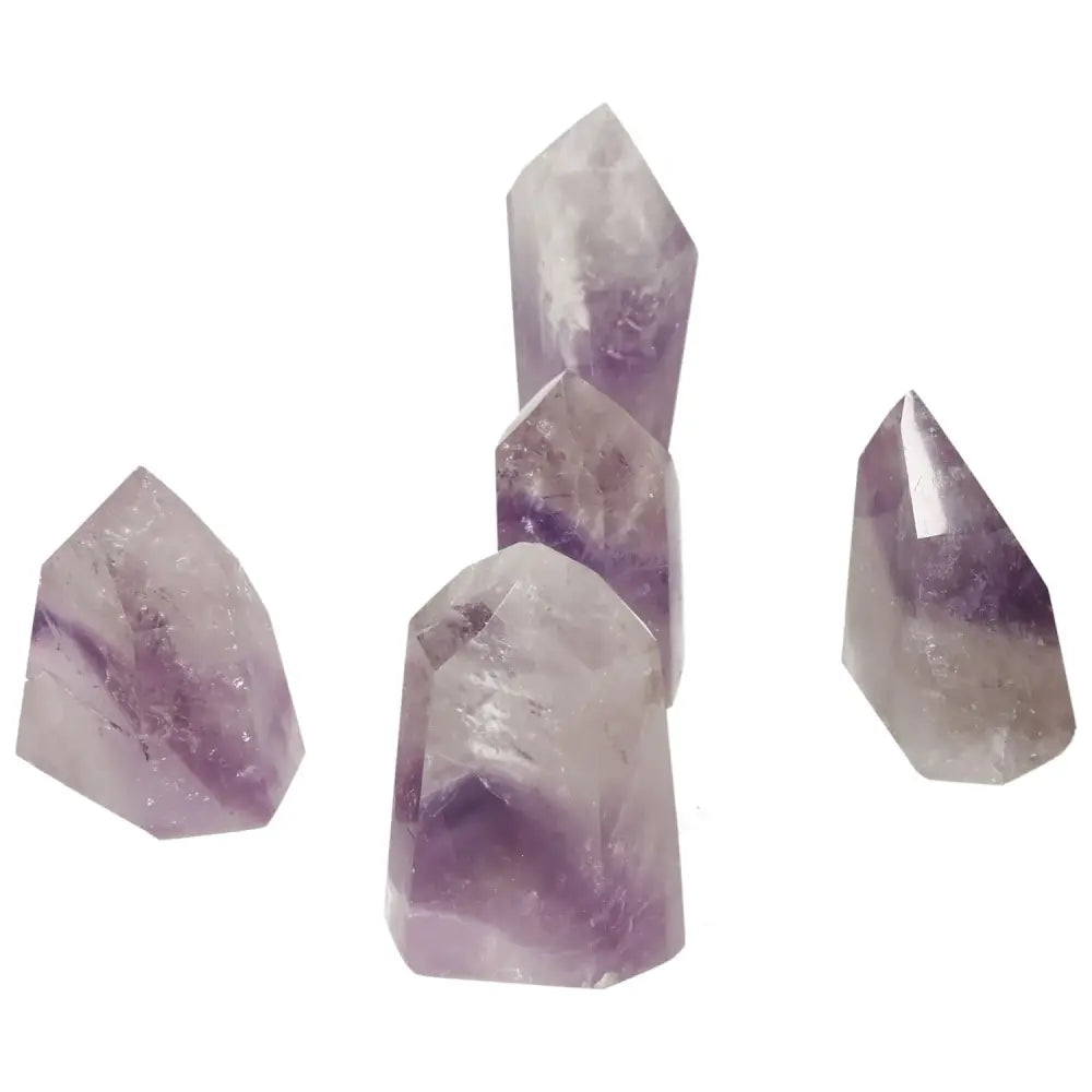 Polished Point Amethyst gemstones from Sylvia Crystals, featuring elegant purple tones ideal for stress alleviation and energy boosting.