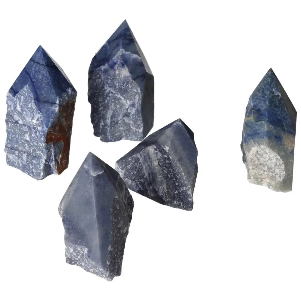 Five polished blue quartz points from Sylvia Crystals, premium quality for tranquility and clear communication in spiritual wellness.
