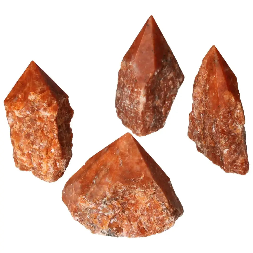Polished Point Calcite L crystals in vibrant orange hues, symbolizing vitality and transformation, from Sylvia Crystals.