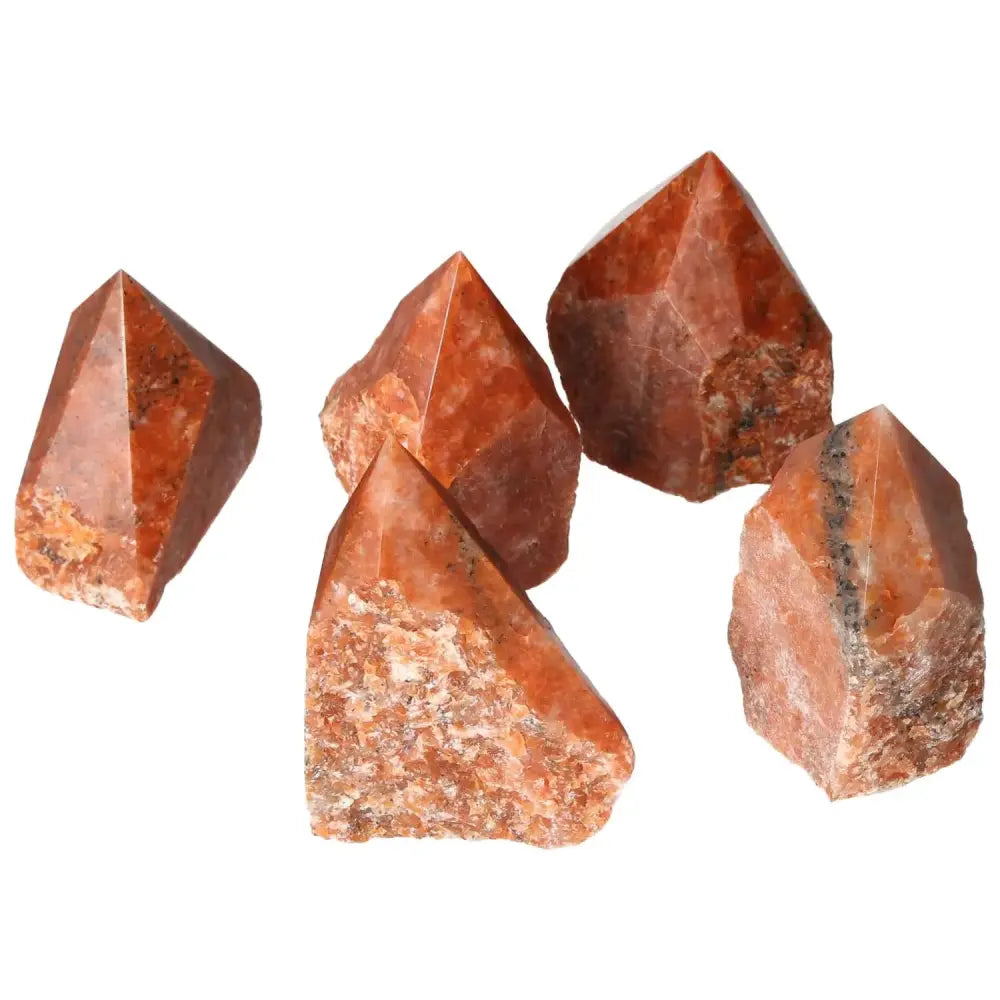 Polished Point Calcite M crystals showcasing fiery tones for luxury and personal transformation from Sylvia Crystals.