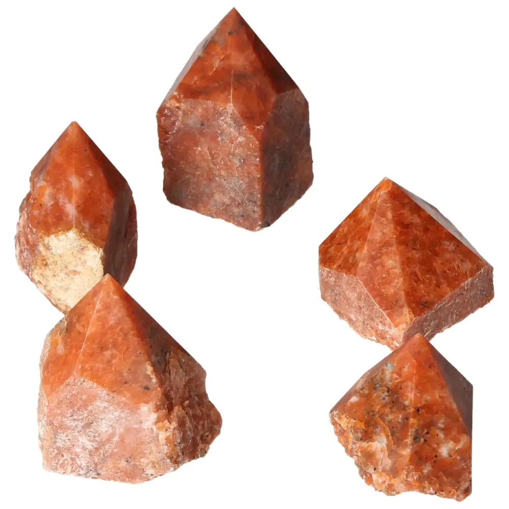 Polished Point Calcite S crystals with vibrant hues, symbolizing willpower and creativity from Sylvia Crystals.