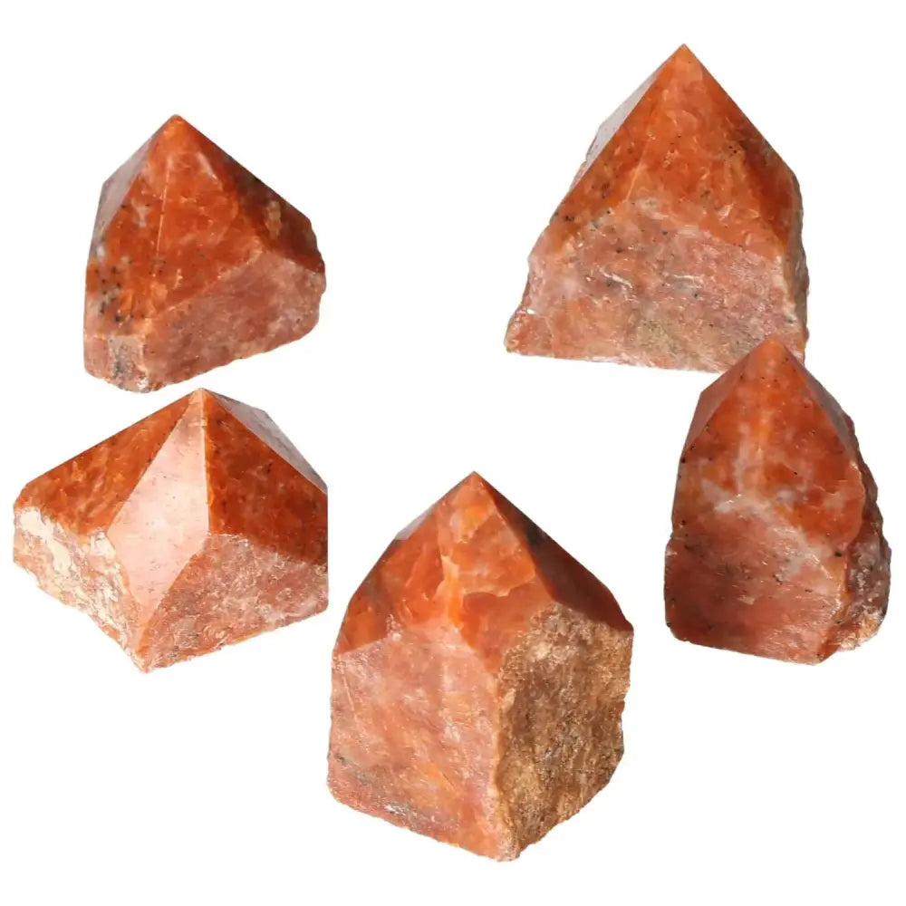 Polished Point Calcite S crystals displaying vibrant hues, symbolizing willpower and determination, from Sylvia Crystals collection.