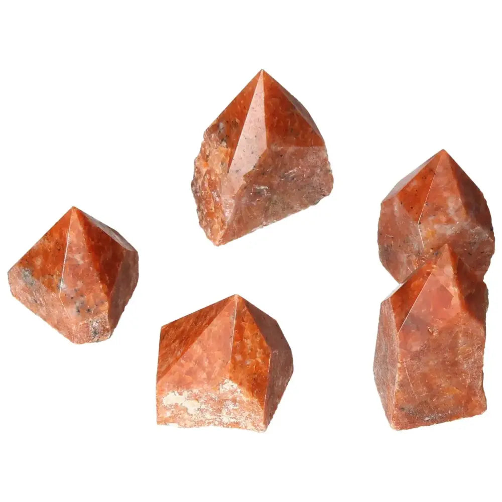 Polished Point Calcite S crystals showcasing vibrant hues, symbolizing willpower and creativity, perfect for enhancing vitality.