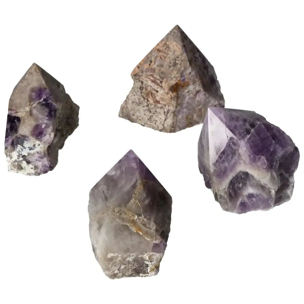 Polished Point Chevron Amethyst L crystals showcasing stunning purple hues and unique patterns, perfect for crystal enthusiasts.