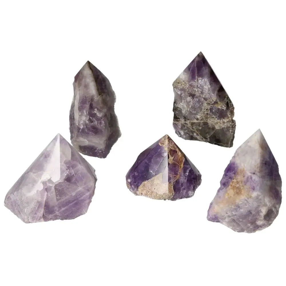 Polished Point Chevron Amethyst gemstones showcasing natural patterns and luxury, from Sylvia Crystals, enhancing balance and tranquility.