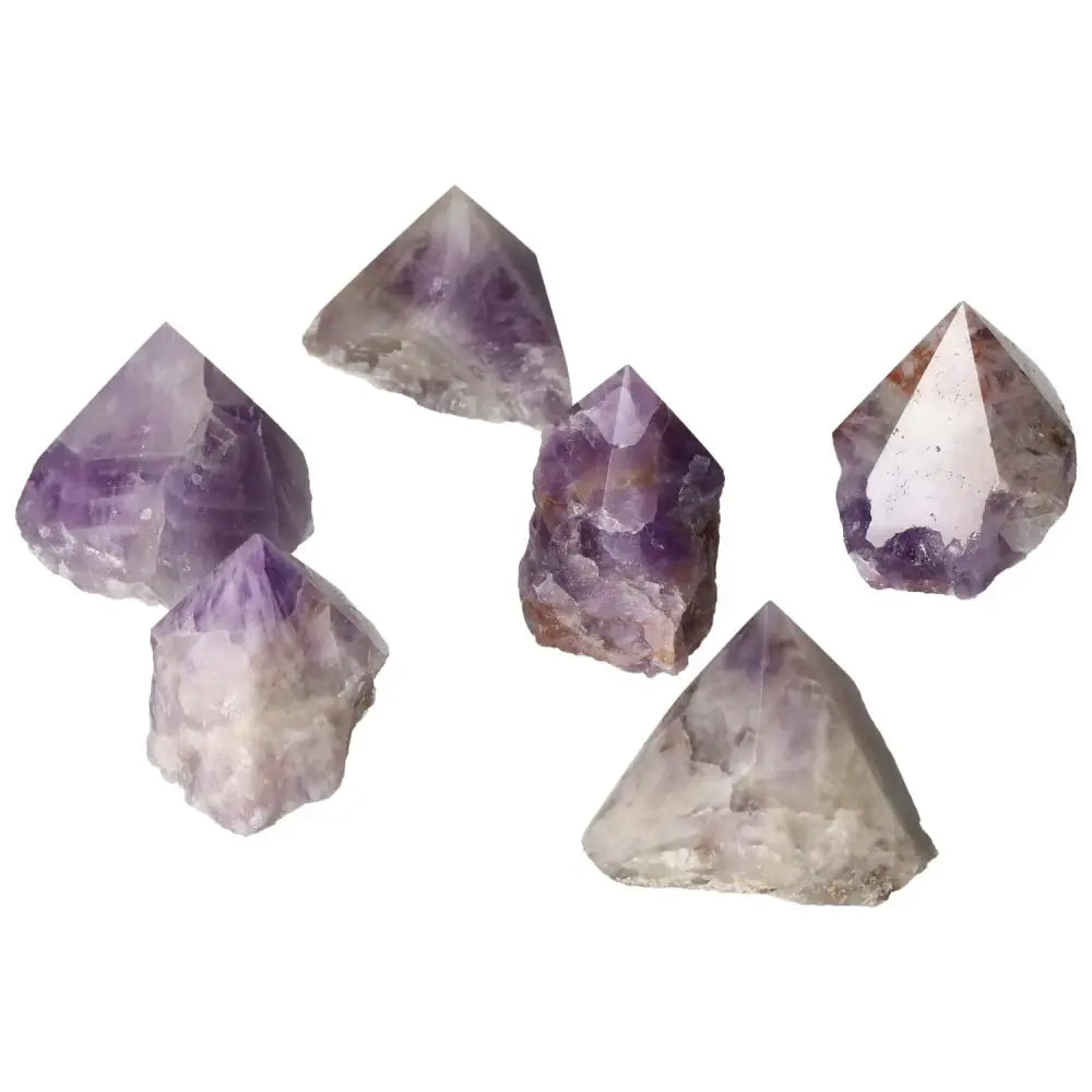 Polished Point Chevron Amethyst gemstones featuring unique chevron patterns, perfect for luxury collections and natural healing.