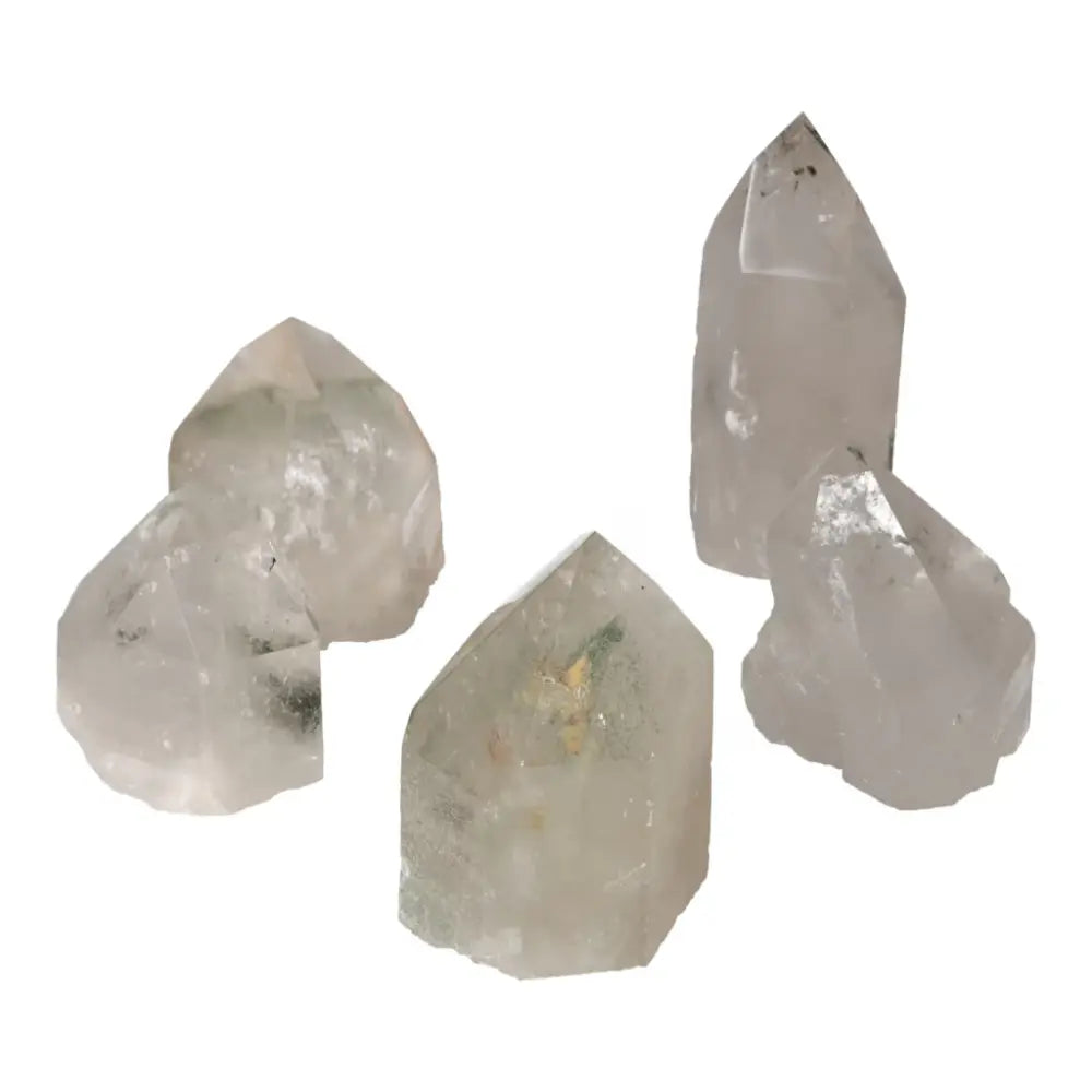 Polished clear quartz points with chlorite, perfect for purification and luxury from Sylvia Crystals.